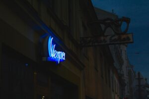 a neon sign on the side of a building