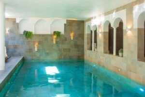 Indoor Pool with Stone Walls and Natural Light