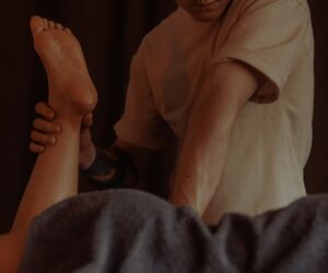 Someone receiving a therapeutic leg massage