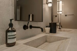 Modern spa bathroom with warm wood cabinetry and ambient lighting