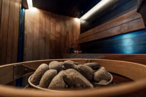 Hot stones in a wooden sauna